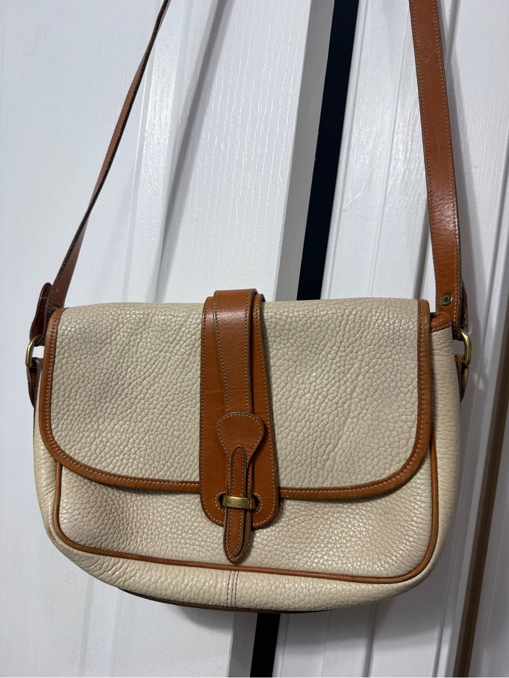 Dooney & Bourke Cream Leather Crossbody with Brown Logo Patch